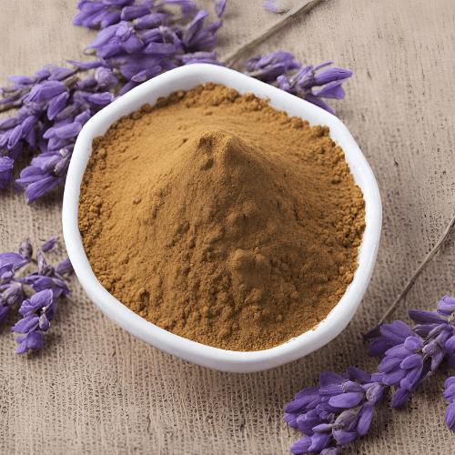 Lions Share Provisions' lavender extract powder in a cup on a table with freshly-picked lavender buds.