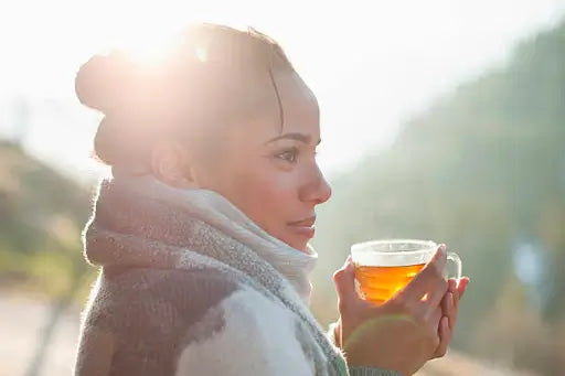 Happy female drinking Lion's Mane mushroom tea 